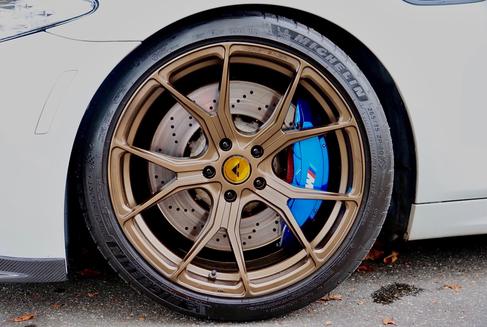 Bronze forged wheel and blue BMW M brake caliper after detail