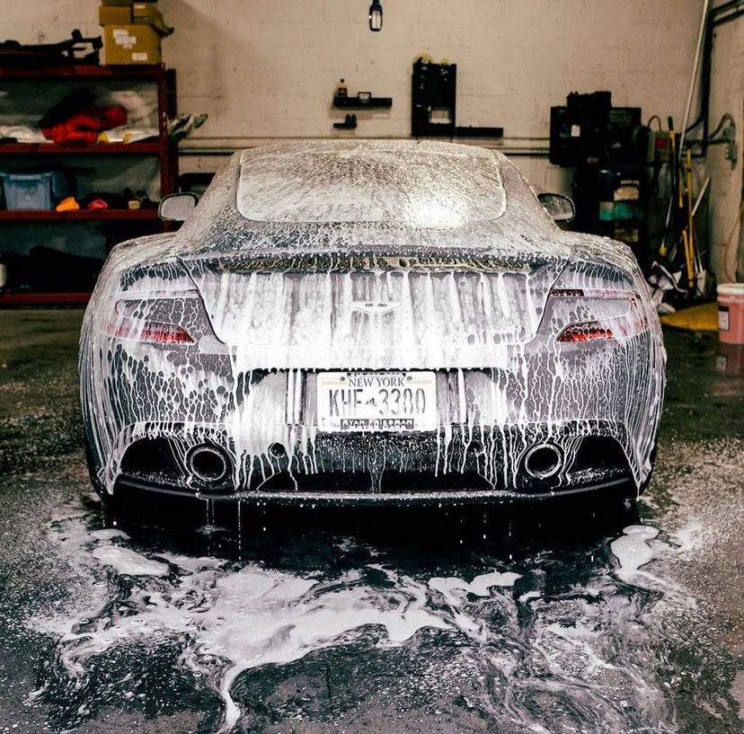 Aston Martin rear under thick foam in the garage